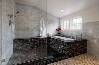 Marble was used throughout the master bathroom in order to create a timeless feel that would age well. "The hope is that in 15 years, you won’t look at the room and think, ‘oh, that tile was only popular in 2015," Michael says.