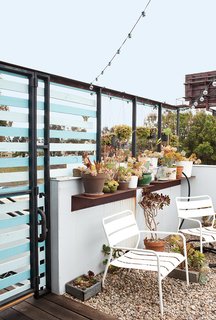 The Bensons’ patio is semi-privatized by horizontal slats.