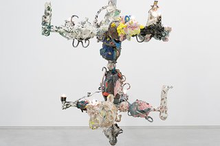 A detail of Francesca DiMattio's Chandelabra II reveals the many ceramic figurines that make up this collage-like porcelain chandelier.