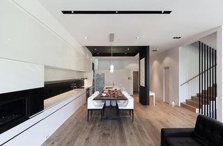 The recessed black ceiling introduces a contrast between the kitchen area and other parts of the house.