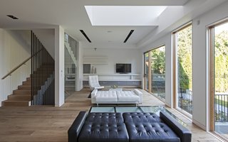 The living area bathed with natural light both from the ceiling to floor glass walls and the void from the second floor allowing one to enjoy tremendous amount of daylight.