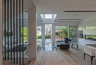 The linear philosophy once again viewed. Starting from top to bottom, void from second floor to glass wall to the glass floor basement.