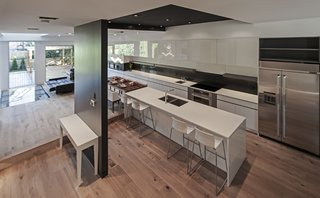 At a wider shot, the long millwork is designed to be as long as the building length itself providing the owner with an immensely amount of storage.