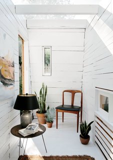 An Architect Builds His Own Backyard Oasis From Salvaged Materials - Photo 3 of 5 - The interior features fence pickets from Hunt’s parents’ house and a rotating selection of furniture from his apartment.