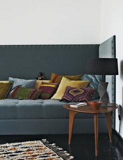 Fehrentz designed the sofa and had it upholstered in fabric by JAB Anstoetz. He cast the concrete base of the table lamp. The 1950s teak coffee table is vintage.