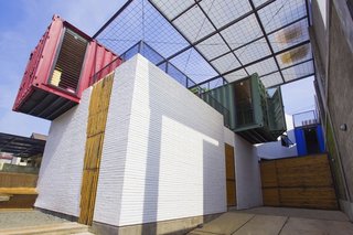 How to Stay Cool by Living in a Shipping Container - Photo 2 of 10 - The 1,668-square-foot three-bedroom home is made of four colorful, crisscrossed containers equipped with a simple ventilation system that facilitates a constant breeze.