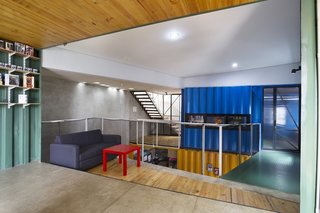 How to Stay Cool by Living in a Shipping Container - Photo 5 of 10 - Natural light pours into the open-plan house, which is outfitted with low-cost materials like polished concrete floors and recycled metal railings.