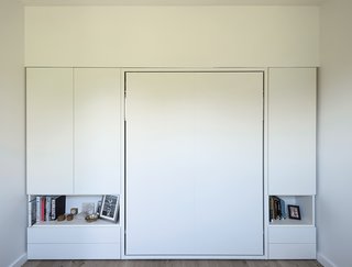 How One Family of Three Does It All in 675 Square Feet - Photo 7 of 14 - The couple’s Murphy bed, Clei’s Penelope model, folds up into the wall.