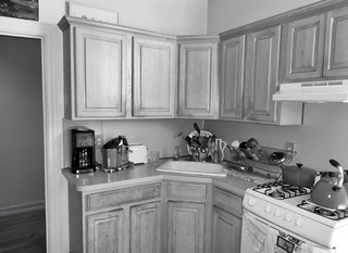 How One Family of Three Does It All in 675 Square Feet - Photo 11 of 14 - Friedlander and Schmidt replaced the stock cabinetry in the kitchen as part of the renovation.
