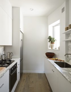 How One Family of Three Does It All in 675 Square Feet - Photo 12 of 14 - In the new space, small-scale, 24-inch appliances from Fagor are incorporated into Ikea’s Applåd cabinetry.
