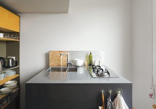 This Is How You Can Live Large in a Small Space - Photo 9 of 9 - The kitchen features a compact cooktop by Whirlpool.