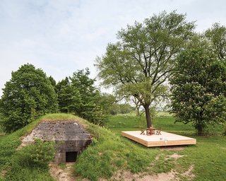 Architect Bruno Despierre built a deck for outdoor activities from pine wood.