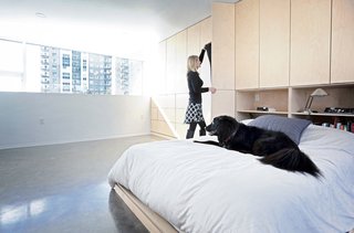 8 Dwell Projects That Were Proudly Designed by Women - Photo 5 of 8 - Concrete was chosen for both structural and finish material throughout much of the home, for its aesthetic, functional, and budgetary appeal. The polished concrete floors in the bedroom complement the birch bed and cabinetry. The home provides living space for the couple, two kids, one dog, and two cats.