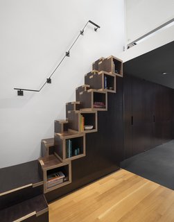 8 Ways to Organize Your Books with Storage Cubbies - Photo 4 of 8 - Confronted with limited space to build the staircase needed to access the living area and bedroom on the second level, General Assembly designed a custom solution. "These stairs are not an ideal design for everyone and shouldn't be used as primary stairs—we like to think of them more as millwork with a little bonus to it, than an actual staircase," Zames says. "The cube construction of the stairs actually came from a budget standpoint. We were very tight on budget and wanted to maximize the material as much as possible."