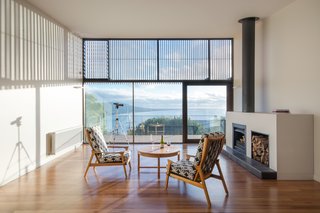 An Australian Beach Home with Stunning Ocean Views - Photo 7 of 8 - Snowdon calls the design of the entire house a collaborative process with the clients, who actually recycled a good deal of furniture from their previous beach house, such as the coffee table and arm chairs seen here