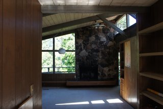 Before<br><br>In the original east-facing living room, the light was partially blocked by a poorly located fireplace.