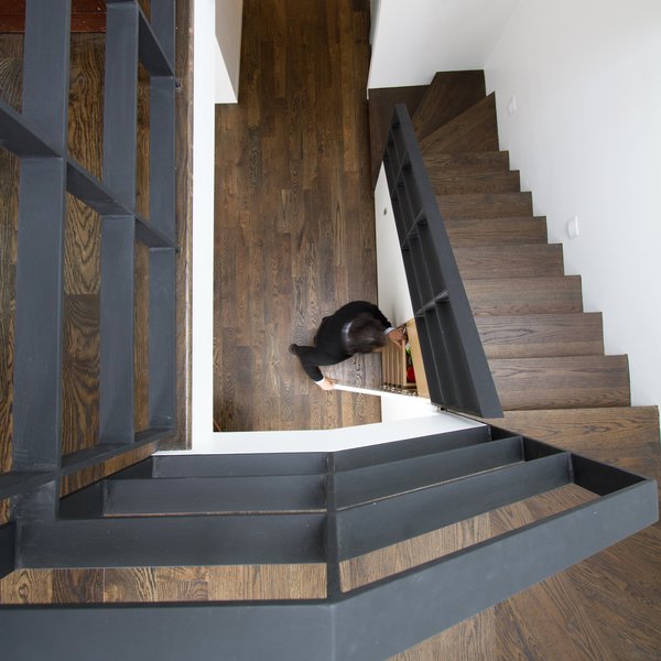 A second staircase—highly unusual in most Brooklyn homes—not only allows renters to access their unit without disturbing the homeowners, but also provides space for storage. To convert the space back into a 2,100 square-foot one-family home, the homeowners simply have to remove a small demising wall on the second floor and demolish the rental kitchen—a job that can be executed over the course of a long weekend. Photo 4 of Revitalization modern home