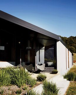 Richly Furnished Home Frames Striking Landscape Views - Photo 2 of 10 - Windows and terraces were designed to frame specific vistas ranging from rural pastures to vineyards, olive groves, and the Hanging Rock outcrop. "The views are very controlled," Titania says.