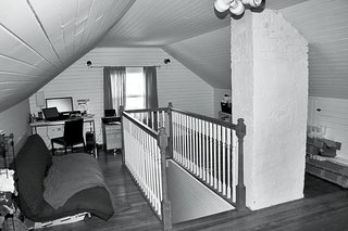 Before the renovation, the attic was a cramped, cluttered space—a feeling reinforced by the presence of a brick chimney that was later demolished and the relatively low 7.2-foot ceilings.