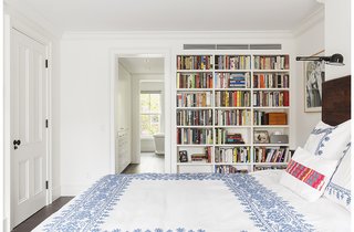 A Neglected Brooklyn Townhouse Becomes a Home That’s Primed for Entertaining - Photo 5 of 8 - Four bedrooms make up the private areas of the home, which all benefit from natural light and a complementary airy design. Custom built-in shelves and a walkthrough closet with enclosed cabinets are featured in this room, as well as bedding by Coyuchi.