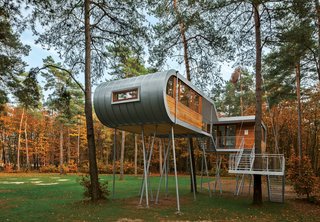 Treehouse by Baumraum, Belgium<br><br>Andreas Wenning's firm Baumraum counts over 40 houses, sited in both rural and urban locales, in its portfolio. To reduce impact at this forested site, Baumraum prefabricated a treehouse and craned it atop 19 steel columns, arranging it so that the surrounding trees’ roots wouldn’t be harmed.