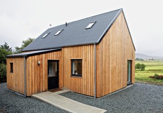 "It’s a beautiful part of the world," says architect Alan Dickson about Scotland's Isle of Skye. "The downside of that beauty is that land is expensive and very difficult for young people to afford, so they’re leaving the island." In 2010, Dickson, of the Skye-based firm Rural Design, and local builder James MacQueen came up with a solution: a small timber-frame prefab design called the R.House, which can be constructed quickly and tucked onto less expensive lots that don’t appeal to well-heeled holiday homeowners.<br><br>Photo by Marcus McAdam.