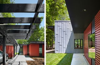 This Light-Filled, Metallic Home Embraces Its Wooded Site - Photo 3 of 8 - The horizontal orientation of the cement board, painted black, creates a line of vision that leads to the forest, while its deep overhangs help shield the sun. A small lawn, gravel, and native grass weave the wooded setting in the residence’s landscape design.