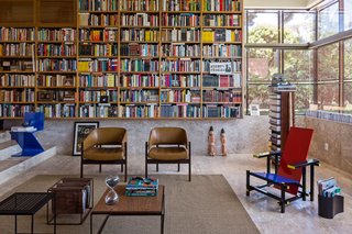 Architect Gustavo Costa calls the home library the "project’s heart." This central space houses the owner’s expansive collection of about 5,000 books, and acts as a meeting place for friends and colleagues. A Gerrit Thomas Rietveld Red and Blue chair completes the space.