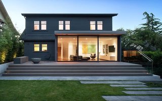 "The backyard, which was kind of the focus of the project, was overgrown and quite disconnected from the house itself," said architect Nigel Parish. The glass doors of the addition open onto a patio and lawn where the kids can play.