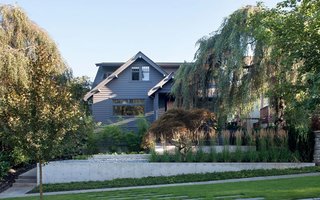 The whole exterior of the home, including the trim, is painted Wrought Iron by Benjamin Moore for a monochromic, quiet look.