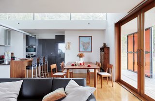 An Off-the-Grid Prefab that Combines Open Plan Living with Rugged Durability - Photo 7 of 10 - The Tasmanian blackwood dining table is by Mark Bishop, and the sofa is from King Furniture.