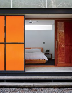 An Off-the-Grid Prefab that Combines Open Plan Living with Rugged Durability - Photo 9 of 10 - The home’s double-skin structure makes the most of Tasmania’s variable climate.