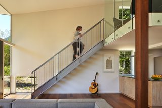 The cabin and studio each have one bathroom and one bedroom, and the entirety of the property has geothermal heat and super insulation. The custom-made stairs in the cabin are by Westside Metal Fabricators in Mount Vernon, Washington.