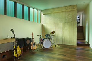 The 1,000-square-foot studio includes a wood shop and music room. The Red Balau wood flooring was treated with Osmo color oil and Osmo Polyx finish. The walls are painted "white heron" by Benjamin Moore.