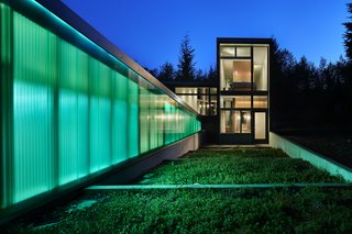 Windows by Milgard allow for views of the terrace below the cabin’s bedroom and the expanse of trees beyond.