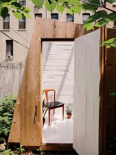 An Architect Builds His Own Backyard Oasis From Salvaged Materials - Photo 2 of 5 - The building’s design was determined by the desire for a strong geometric form and by the materials Hunt could find. The cedar cladding is meant to fade over time.