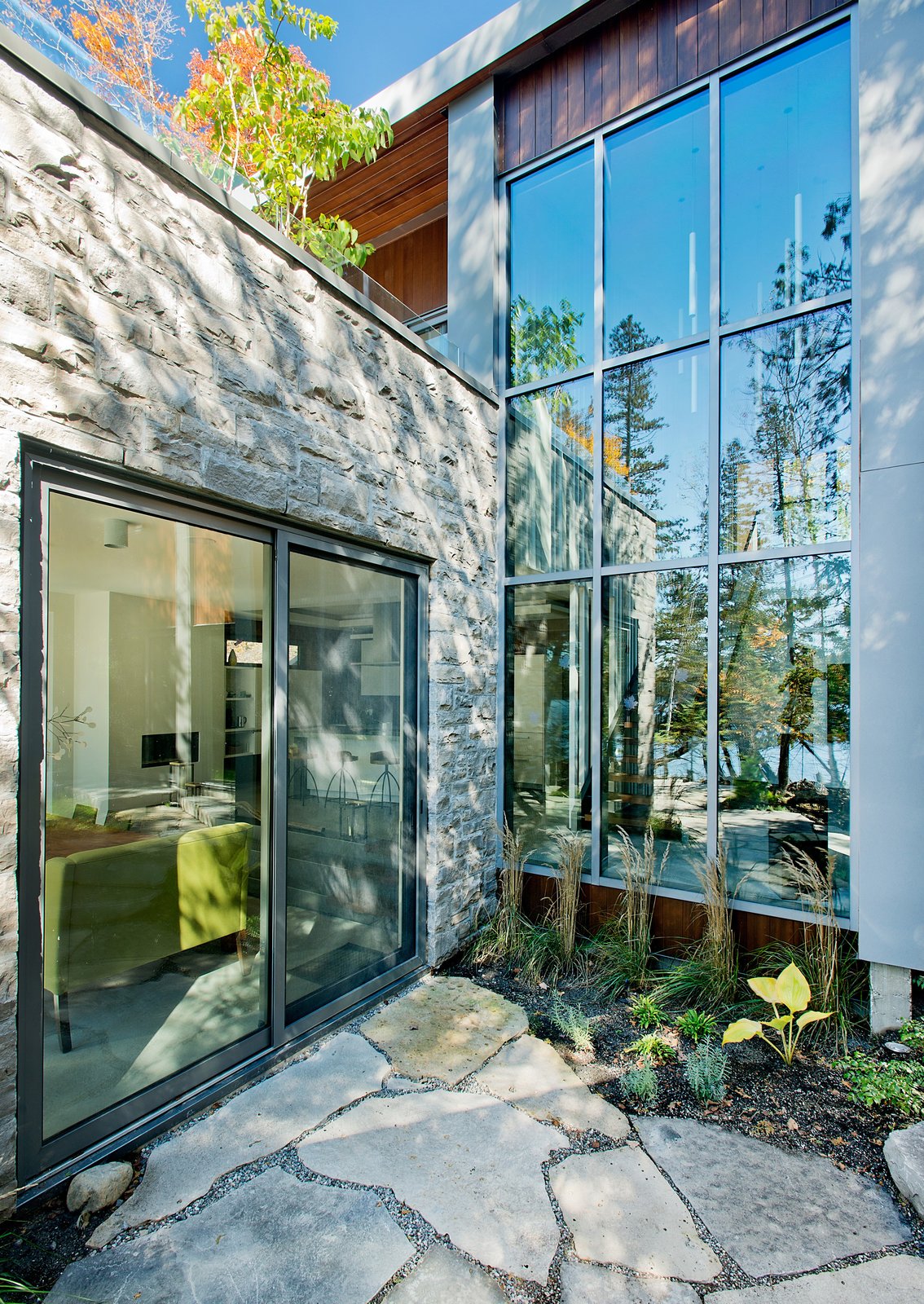While the homeowners and their guests have plenty of opportunities to view the outdoors, thanks in large part to windows and doors by Alumilex, an abundance of cedars offers privacy from the outside looking in. “We wanted to cut the least amount of trees,” Tremblay said.