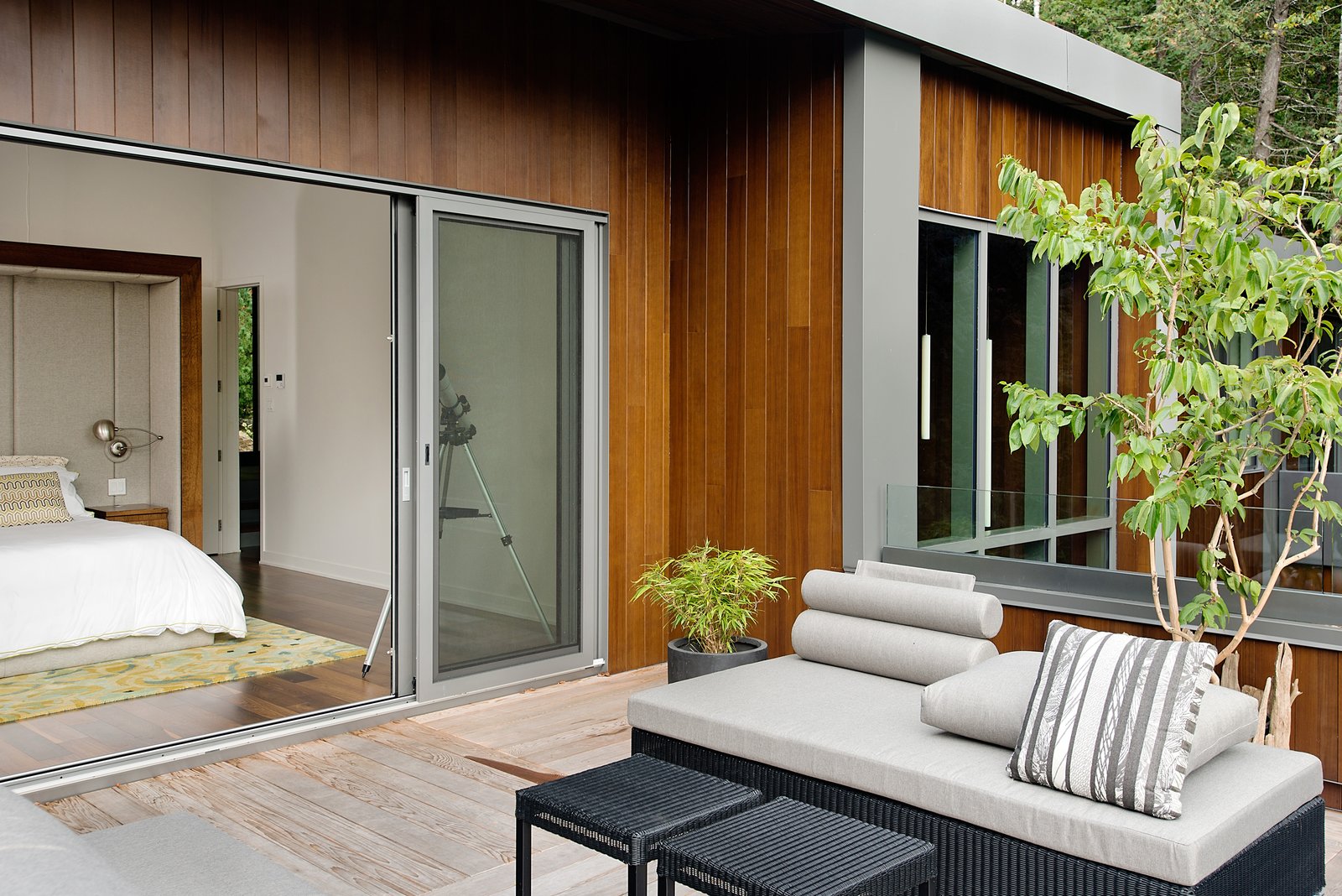“The roof terrace accessed from the master bedroom is the sunniest place, naturally,” said Tremblay. A custom-made bed by Boom Town, Tremblay’s firm, is outfitted with linens by Kravet. Outdoor seating is by Jardin de Ville.
