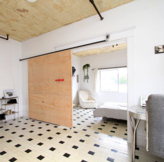 Photo of the Week: Simple Sliding Door Made of Spare Plumbing Parts - Photo 1 of 1 -