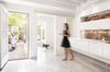 Modern home with kitchen, white cabinet, light hardwood floor, and recessed lighting. Architects who practice in dense cities know its almost impossible to add square footage to an apartment. Yet at a garden-level residence in Boston's historic Beacon Hill neighborhood, Chris Greenawalt of Bunker Workshop was able to unearth 70 square feet of living space through a little excavation. Photo of Beacon Hill