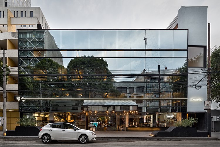 The street-facing mirrored-glass facade is likely a remnant of a 1980s renovation—an attempt to modernize the building as the colonia deteriorated around it. The architects decided to keep what they considered a challenging design element to showcase the concept of the building, much like the neighborhood around it, slowly revealing its beauty layer by layer.
To complete the project, JSa called in an army of young interior designers and emerging artists, who transformed each room into a singular place to stay in the capital city—one that combines chic accommodations with a total immersion in a city's booming design scene.