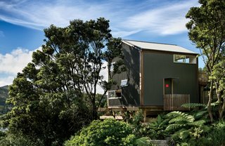 Inspired by the small scale of Japanese residences—in particular, Makoto Masuzawa’s 1952 Minimum House—architect Andrew Simpson designed his own economical 538-square-foot home, set into a wooded site in Island Bay, a coastal suburb outside Wellington, New Zealand.