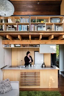 On the ground floor, Simpson’s fiancée, Krysty Peebles, makes coffee in a compact kitchen outfitted with a Foraze Panni sink, Bosch induction cooktop, and Mitsubishi refrigerator.