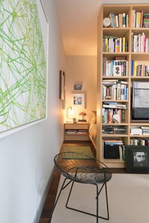This Luxurious Apartment in Greenwich Village Is Only 520 Square Feet - Photo 1 of 6 - Custom built-ins were essential in defining and maximizing the 520-square-foot space. Greg Dufner designed the rift-cut white oak bookcase that separates the sleeping area from the rest of the studio.