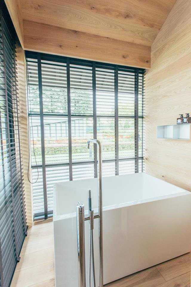 40 Modern Bathtubs That Soak In the View The main draw of Fukasawa's hut: a bathroom featuring a large, Japanese-style tub with a view.
