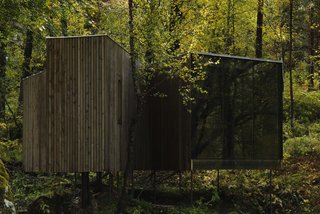 Designed by Jensen & Skovdin, the Juvet's first-generation cabins are built on stilts in order to impact the environment as little as possible. Despite the modernist aesthetic, the buildings were built by local craftsmen using traditional materials and techniques.