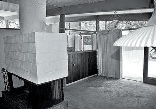 The pair worked with the existing chunky fireplace and concrete floors.