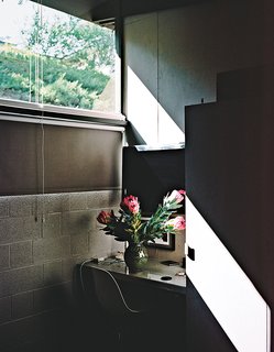 They used a deep-black hue for the room’s cabinetry and built-in desk.