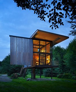 At just 350 square feet, this remote cabin with a view for the Sol Duc River sits on stilts to protect it from flooding and the dampness of the northwestern rainforest. Its shutters can be operated manually by custom steel rods.