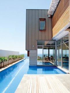 Wright Feldhusen Architects designed this house for a client that loves to swim. A lap pool connects the home to the ocean that lies beyond the property in Maroubra, Australia, a suburb of Sydney.